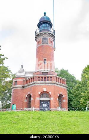 Il faro in mattoni rossi del fiordo di Kiel con base ottagonale fu costruito nel 1895 e segna l'ingresso del canale di Kiel, Kiel, Schleswig-Holstein, G. Foto Stock