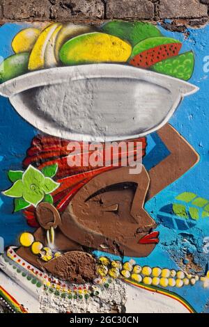 Murale Street art di un distributore di frutta Palenquera su un muro a Getsemani, Cartagena. Foto Stock