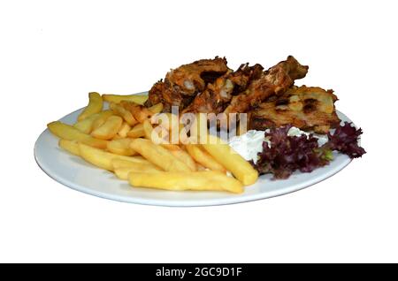 costolette di maiale e patatine fritte, porzione di costolette di maiale con patate su un piatto bianco Foto Stock