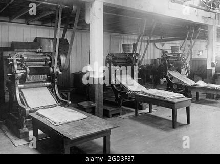 Stampanti di stampa. Stampa dei contenitori di zucchero tra circa 1910 e 1920 Foto Stock