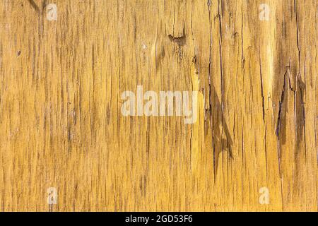 Vecchio cracked giallo verniciato legno superficie texture sfondo Foto Stock