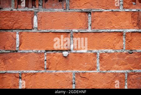 Vecchio muro di mattoni rossi. I mattoni sono posati in file. Grunge pietra tessitura. Foto di alta qualità Foto Stock