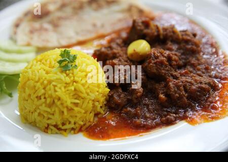 Maiale al curry con riso, curry hinlay Foto Stock