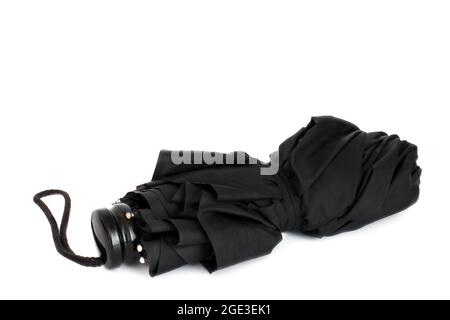 Ombrello nero su sfondo bianco Foto Stock