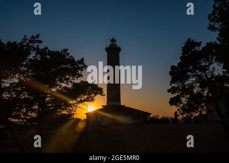 Tramonto sul faro di Veli Rat sull'isola di Dugi Otok, Croazia Foto Stock