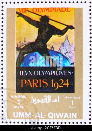 UMM al-QUWAIN - CIRCA 1972: Un francobollo stampato in Umm al-Quwain mostra Parigi 1924, Francia, Giochi Olimpici del passato, circa 1972 Foto Stock