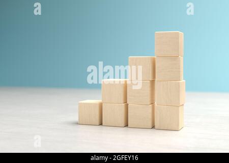 Cubi di legno impilati l'uno sull'altro in pile crescenti. Può essere usato per mettere i vostri propri segni sui cubi Foto Stock