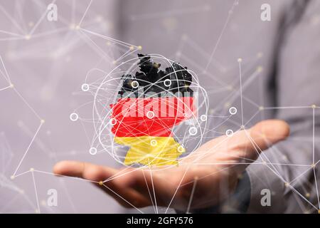 Primo piano della mappa tedesca in 3d resa in una mano di uomo Foto Stock