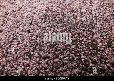 Sfondo tappeto fleecy beige con colore nero Foto Stock