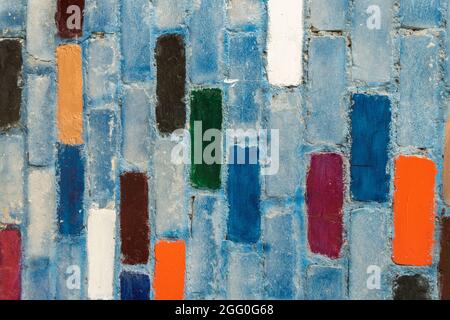 Arcobaleno colorato muro di mattoni sfondo. Texture muro di mattoni con blocchi colorati Foto Stock