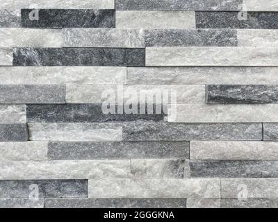 Sfondo della parete in marmo. Muro di mattoni di marmo come texture e sfondo. Foto Stock