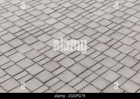 Superficie urban grigio pavimento texture pavimentazione pietra mosaico piastrelle grigio strada soletta sfondo. Foto Stock