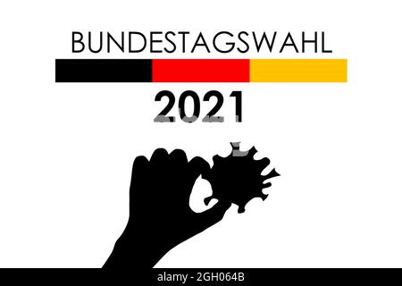 Una persona tiene il coronavirus sopra la bandiera tedesca e il simbolo di elezione. Bundestagswahl 2021. Elezione al Parlamento tedesco Bundestag 2021 durante il Covid-19 Foto Stock