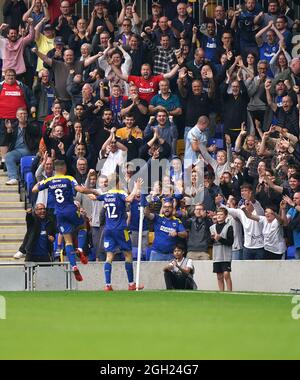 Jack Rudoni di AFC Wimbledon festeggia il terzo gol del gioco durante la partita della Sky Bet League One a Plow Lane, Londra. Data foto: Sabato 4 settembre 2021. Foto Stock