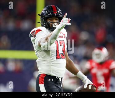 4 settembre 2021: Texas Tech Red Raiders Wide Receiver Erik Ezukanma (13) gesti dopo aver raccolto un primo giù su un ricevimento durante una partita di calcio NCAA tra Houston e Texas Tech il 4 settembre 2021 a Houston, Texas. (Credit Image: © Scott Coleman/ZUMA Press Wire) Foto Stock