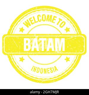 BENVENUTI A BATAM - INDONESIA, parole scritte su un francobollo giallo grungo Foto Stock