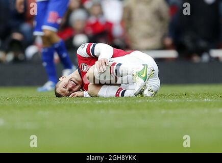 Il Jack Wilshere dell'Arsenal si prende cura del dolore dopo un'azione durante la partita della Barclays Premier League all'Emirates Stadium di Londra il 27 ottobre 2012. Foto Stock