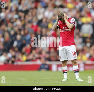 Il Jack Wilshere di Arsenal è sconsolato durante la partita della Barclays Premier League tra l'Arsenal e l'Aston Villa all'Emirates Stadium di Londra il 17 agosto 2013. David KleinLandov Foto Stock