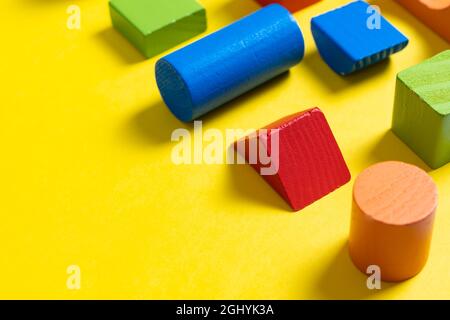 Colorful geometric shapes on yellow background for design Foto Stock