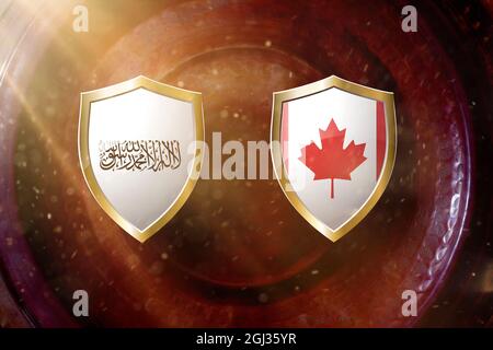 bandiera dei talibani e del canada in scudo dorato su sfondo di struttura in rame. Foto Stock