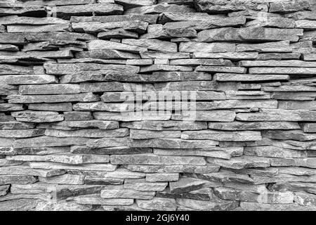 Muro lastricato di pietra come sfondo. Foto Stock
