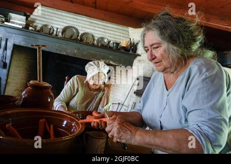 Fiera della contea a Old Richmond Town su Staten Island, New York. Cucina storica re enactors. (Solo per uso editoriale) Foto Stock