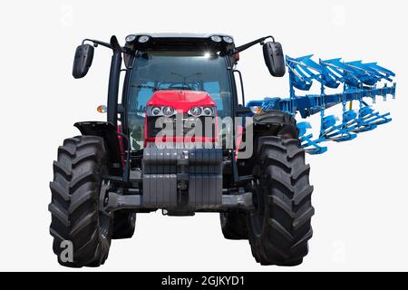 trattore con aratro agricolo Foto Stock