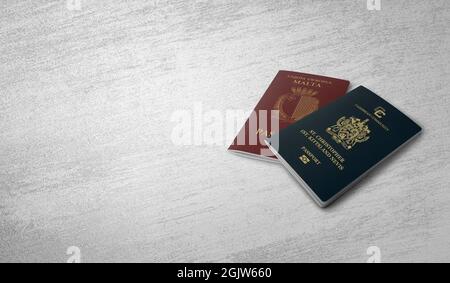 passaporto . Malta, Saint Kitts e Nevis su un muro di cemento Foto Stock