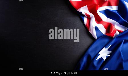 Australia Day Concept. Bandiera australiana su sfondo lavagna. 26 gennaio. Foto Stock