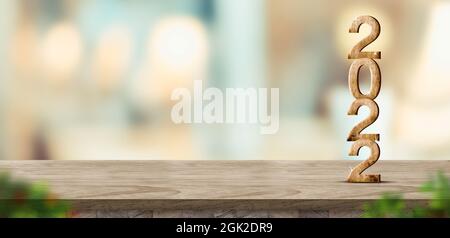 Anno nuovo 2022 (rendering 3d) su tavolo di legno marrone a sfocatura astratto bokeh sfondo casa chiaro con sfumatura foglia primo piano, Mock up banner per la visualizzazione di Foto Stock