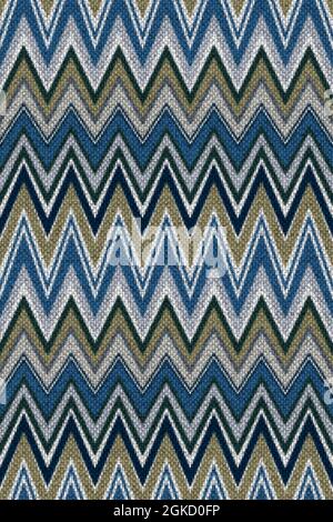 Strisce real zig-zag in maglia a chevron. Ripetizione continua. Strisce in blu, verde e grigio. Foto Stock