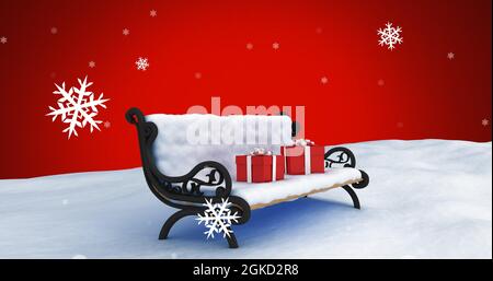 Immagine digitale della neve che cade sulle scatole regalo sul banco sul paesaggio invernale contro il backgroun rosso Foto Stock