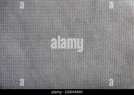 Texture sfondo foto di tessuto sintetico grigio. Foto Stock