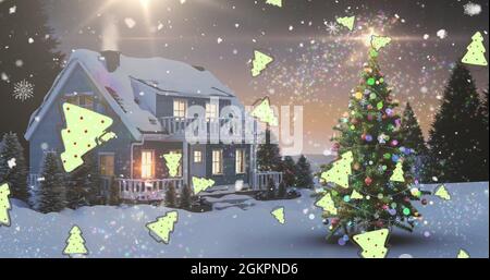 Immagine digitale della stella di tiro e più icone dell'albero di natale che cadono contro la caduta della neve Foto Stock