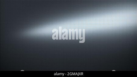 Piastra metallica forata con luce spot. Primo piano su sfondo metallico Foto Stock