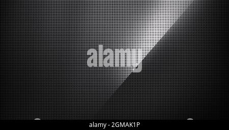 Piastra metallica forata con luce spot. Primo piano su sfondo metallico Foto Stock