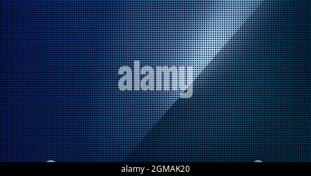 Piastra metallica forata con luce spot. Primo piano su sfondo metallico Foto Stock