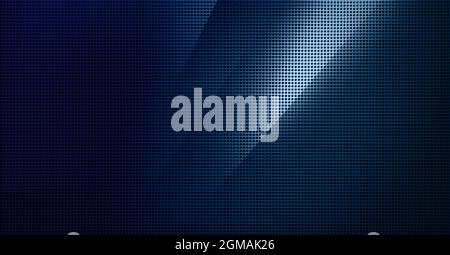 Piastra metallica forata con luce spot. Primo piano su sfondo metallico Foto Stock