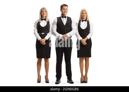 Squadra di camerieri in uniformi che si posa isolato su sfondo bianco Foto Stock