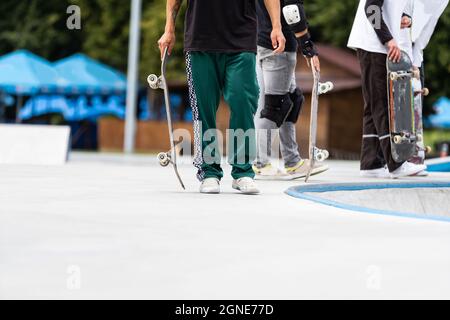 Close up of a skateboarders feet while skating on concrete at the skate park Stock Photo