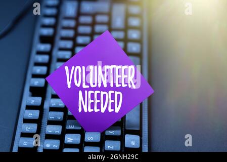 Testo della scrittura Volontario necessario. Foto concettuale in cerca di aiuto per fare attività senza pagare o compensazione digitando nuovo libro di testo educativo Foto Stock