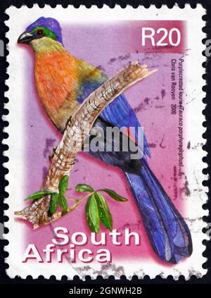 SUD AFRICA - CIRCA 2000: Un francobollo stampato in Sud Africa mostra Turaco, Lourie, Tauraco porfireolophus, circa 2000 Foto Stock