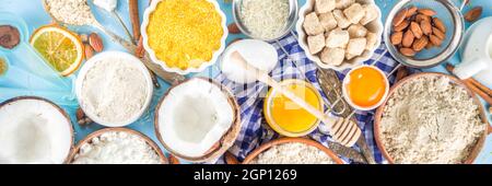 Cottura cottura cottura cottura cottura sfondo cornice sfondo. Selezione di vari ingredienti e farine senza glutine, per panetteria dolce e pane, su coloratissima cannella blu Foto Stock