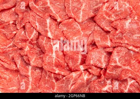 carne giapponese di qualità superiore tagliata a fette di manzo marmorizzato di wagyu come sfondo Foto Stock