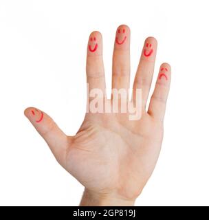 Mano con le dita le faccine, tranne un dito triste, isolati su sfondo bianco, il concetto di comunicazione. Foto Stock