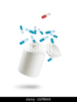 Capsule blu di medicina e una rossa saltano fuori dal flacone, su sfondo bianco Foto Stock