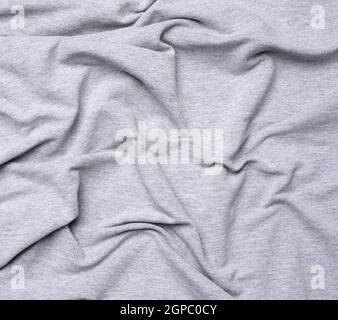 tessuto di cotone grigio chiazzato per abbigliamento, tessuto crespato, primo piano Foto Stock