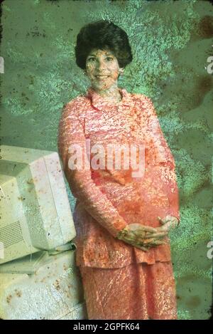 Austin Texas USA, 1994: La madre incinta in attesa a 7 mesi pone nel suo ufficio. ©Bob Daemmrich Foto Stock