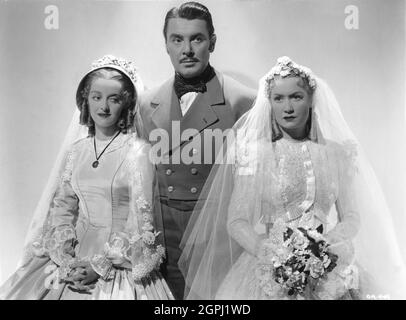 BETTE DAVIS GEORGE BRENT e MIRIAM HOPKINS Ritratto pubblicitario di GEORGE HURRELL nella VECCHIA CAMERIERA 1939 regista EDMUND GOULDING sceneggiatura Casey Robinson basato sul romanzo di Edith Wharton e gioco di Zoe Akins musica Max Steiner costume design Orry-Kelly Warner Bros.. Foto Stock