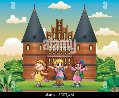 Cartoon di bambini della scuola felice in piedi di fronte al palazzo Holstentor Illustrazione Vettoriale